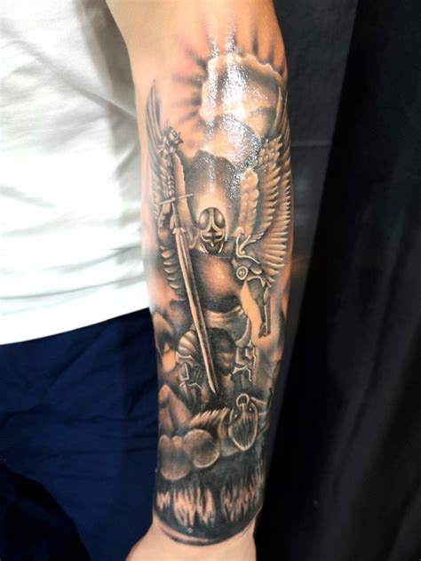 angel with devil tattoo|angel killing a demon tattoo.